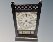 A late Victorian ebonised mantel clock.