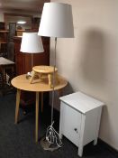 A circular Ikea pine occasional table together with a further pine nursery stool bedside cabinet