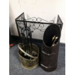 A folding metal spark guard together with four piece cast companion set on stand,