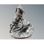 An early 20th century bronze figure of two goats on plinth.