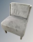 A contemporary bedroom chair in grey fabric