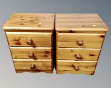 A pair of pine three drawer bedside chests