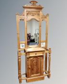 A pine Victorian style mirrored hall stand