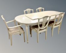 A cream extending dining table, plus two leaves (total length 250 cm),
