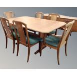 A mid century teak G-plan extending dining table and six chairs