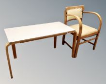 A 20th century beech bentwood armchair together with Esavian melamine topped table