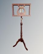 A Victorian style adjustable twin sided music stand