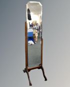An Art Deco bevelled cheval mirror on stand
