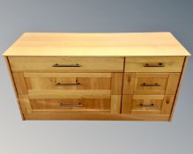 A contemporary six drawer chest