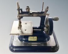 A child's Vulcan vintage sewing machine.