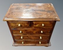 A hardwood Victorian style miniature five drawer chest