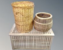 A teak linen box and two wicker baskets