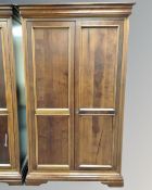 A Willis and Gambier cherry wood double door wardrobe