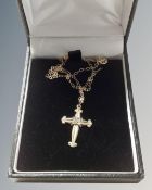 A 9ct yellow gold crucifix pendant on chain.