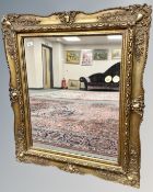 An antique style gilt framed mirror, 88cm by 100cm.