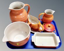 A tray of Le Creuset pottery kitchenware, storage dish, jugs etc.