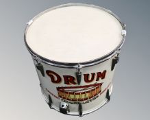 A large drum with Smoking Granulated Tobacco advertisement painted decoration.