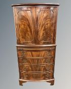 A Regency style mahogany bow fronted double door cocktail cabinet