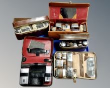 A tray of mid-20th century gent's travel sets, chrome plated examples etc.