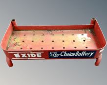 A metal painted advertising stand for Exide Choice Batteries.