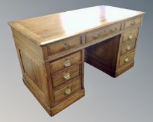 A 19th century nine drawer twin pedestal desk