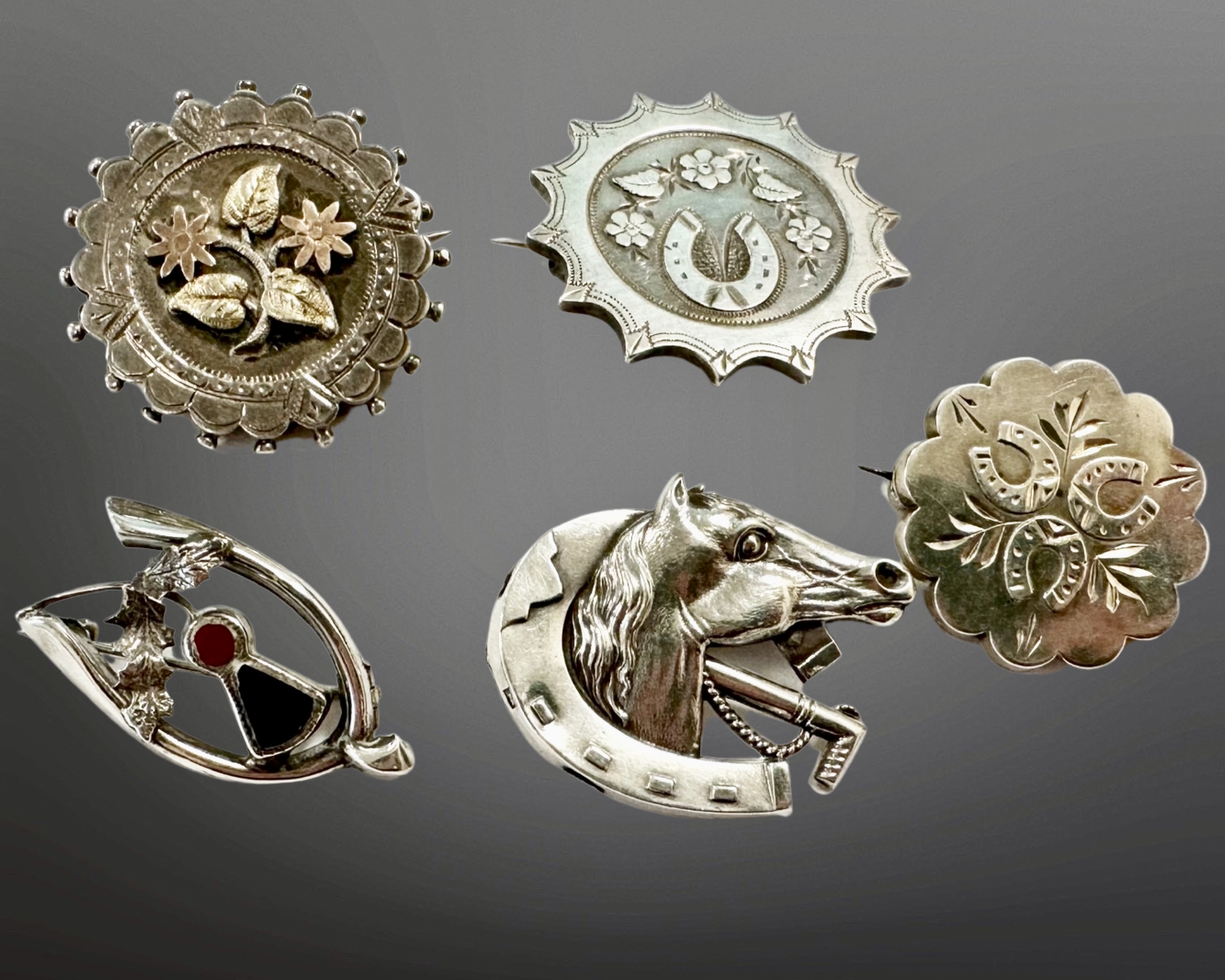 A group of five antique and later silver brooches including Scottish agate and bloodstone example,