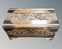 A carved camphor wood blanket chest