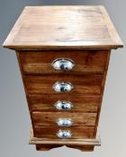 An Asian hardwood narrow five drawer chest