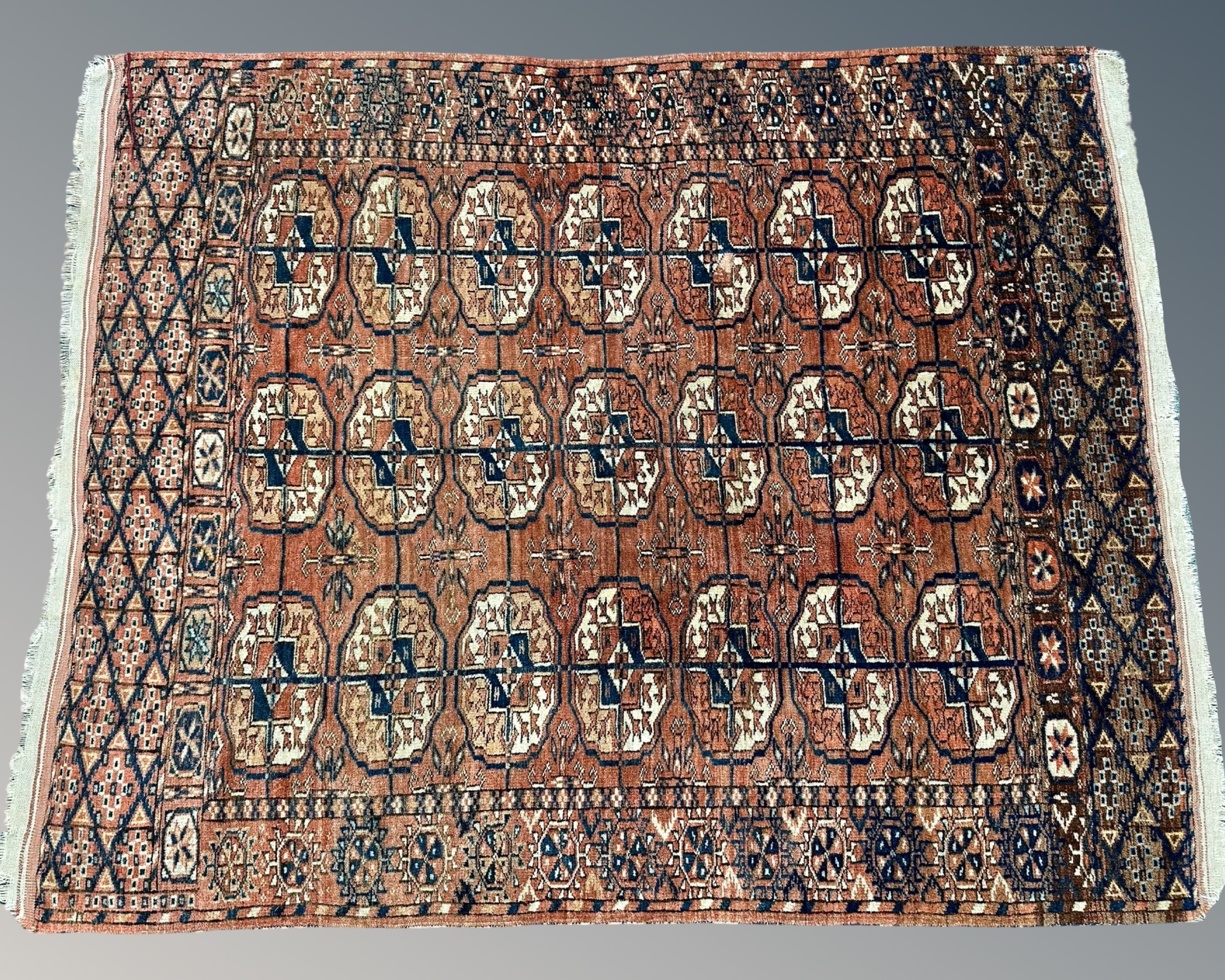 A Tekke rug, Afghanistan, 110cm by 135cm.