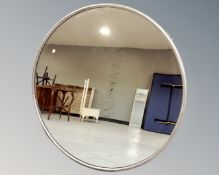 A Hill Furniture circular metal framed wall mirror.