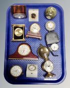 A tray of assorted desk clocks