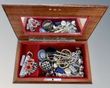A musical jewellery box containing costume jewellery, buttons,