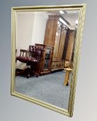 A rectangular gilt framed bevel edged overmantel mirror, 132cm by 100cm.