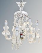 A vintage cut glass five branch chandelier with crystal drops.