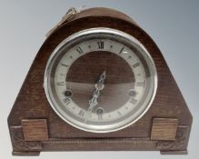 A 1930s oak cased Westminster chime mantel clock, with key.
