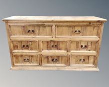 A contemporary pine eight drawer block chest,