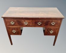 A 19th century mahogany four drawer kneehole dressing table.
