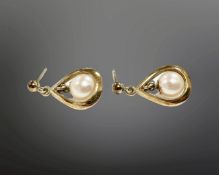 A pair of 9ct gold cultured pearl earrings with post fittings. CONDITION REPORT: 2.