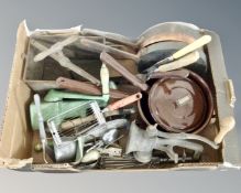A box of kitchenalia to include cast iron handled pans, press,