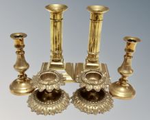 Three pairs of miniature brass candlesticks