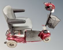 A mobility scooter with key and charger.