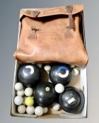 A box of a set of four composite lawn bowls with bag together with a quantity of golf balls