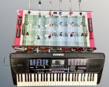 A table top football game together with Yamaha PSR-230 electric keyboard