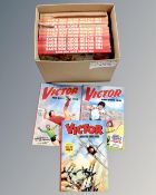 A box containing sixteen 1970s and 1980s Victor annuals.