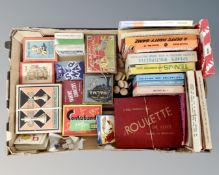 A box of mid 20th century games, playing cards,