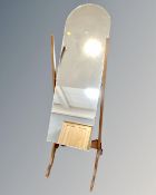 A cheval mirror on stand.