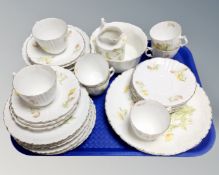 A tray of vintage bone china tea service decorated with flowers