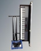 A Roland RD-150 electric piano with flight case together with folding keyboard stand,