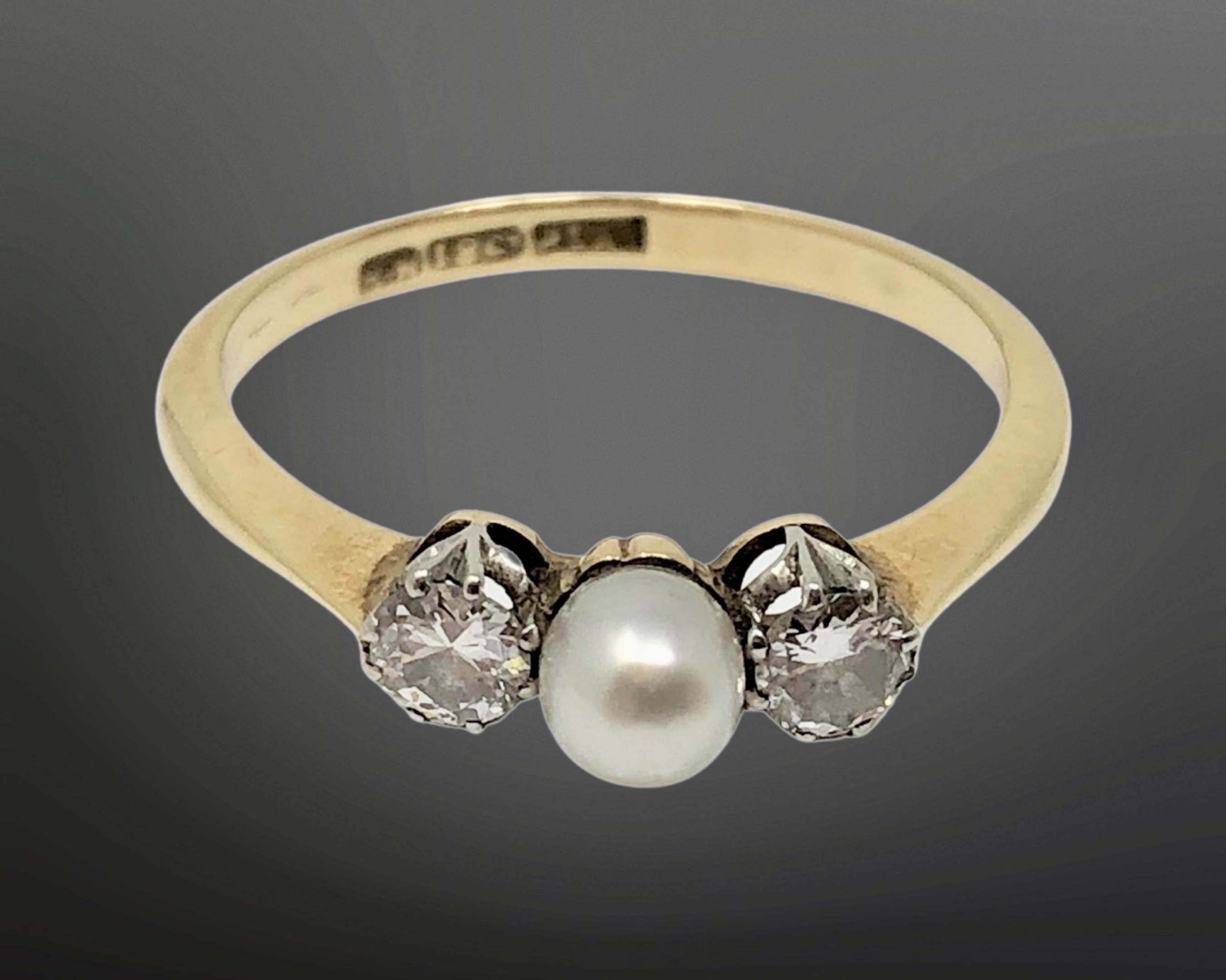 An 18ct gold pearl and diamond ring, size P. CONDITION REPORT: 2.4g.