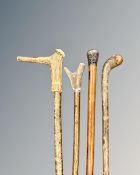 A Victorian walking cane with white metal embossed mount,